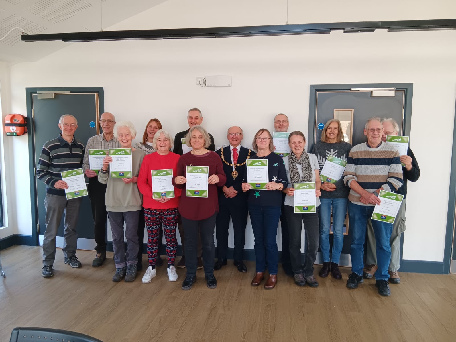 Mote park Fellowship volunteers receiving
                certificates of appreciation from the Mayor Gordon Newton.